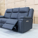 The Dylan Three Seater Triple Motor Electric Recliner Lounge - Jet available to purchase from Warehouse Furniture Clearance at our next sale event.