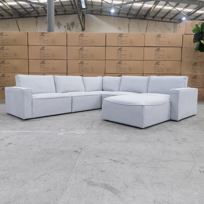 The Layne Modular Corner Lounge with Ottoman - Silver available to purchase from Warehouse Furniture Clearance at our next sale event.