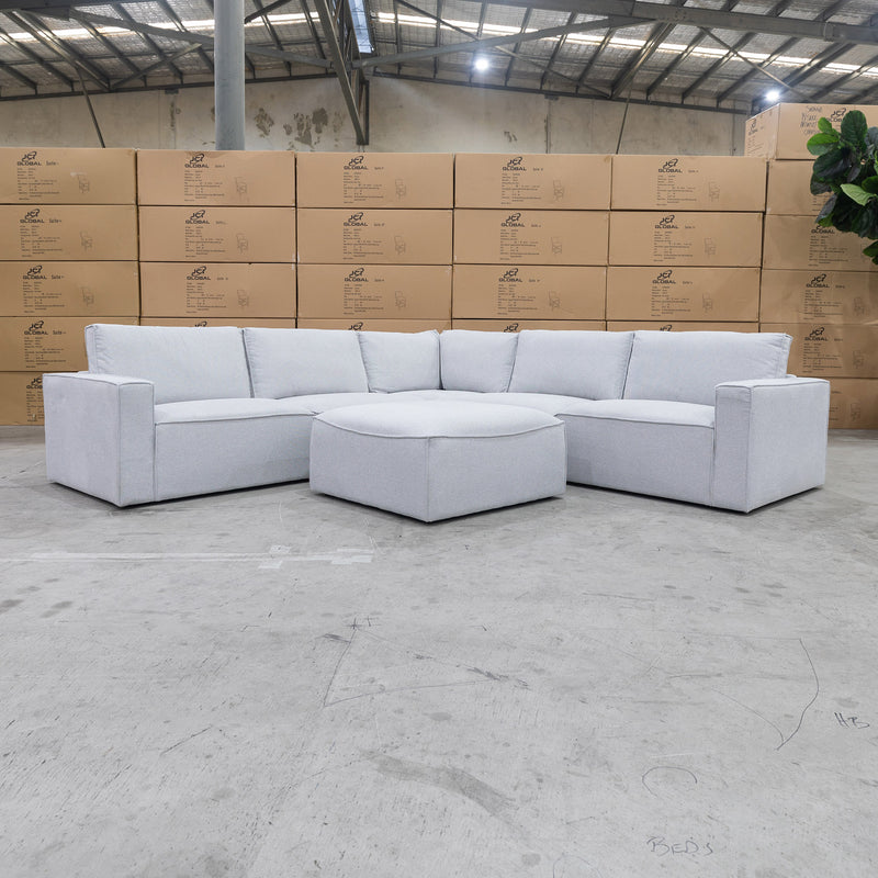 The Layne Modular Corner Lounge with Ottoman - Silver available to purchase from Warehouse Furniture Clearance at our next sale event.