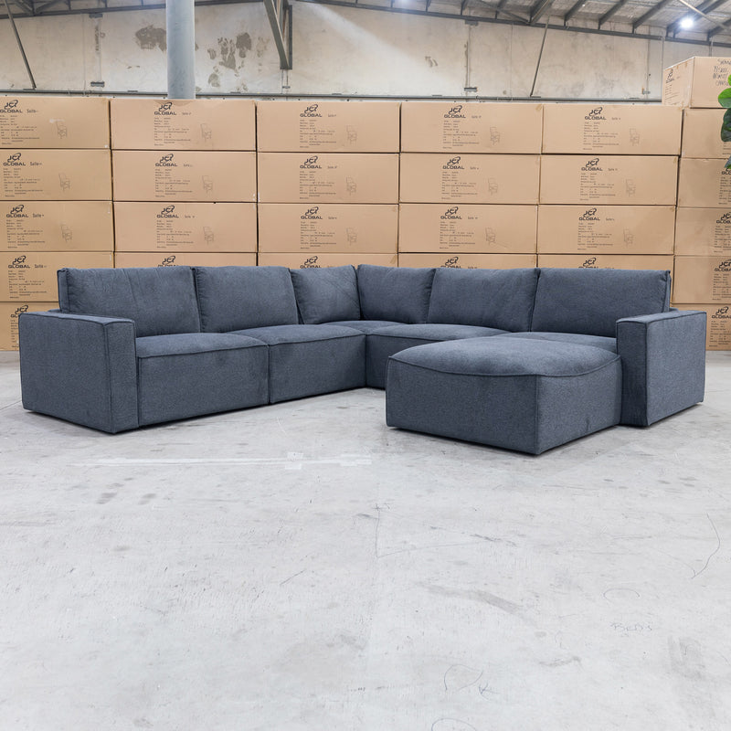 The Layne Modular Corner Lounge with Ottoman - Charcoal available to purchase from Warehouse Furniture Clearance at our next sale event.