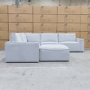The Layne Modular Corner Lounge with Ottoman - Silver available to purchase from Warehouse Furniture Clearance at our next sale event.