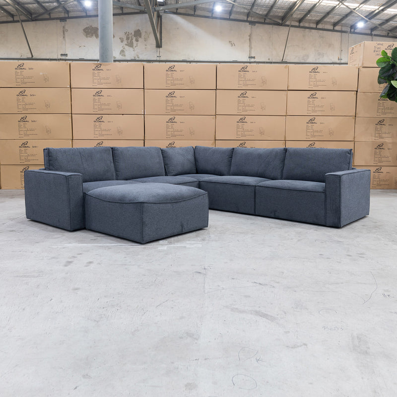 The Layne Modular Corner Lounge with Ottoman - Charcoal available to purchase from Warehouse Furniture Clearance at our next sale event.