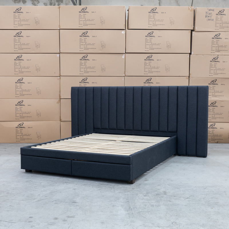 The Isla Queen Upholstered Storage Bed Extended Headboard - Charcoal available to purchase from Warehouse Furniture Clearance at our next sale event.