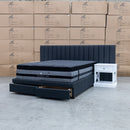 The Isla Queen Upholstered Storage Bed Extended Headboard - Charcoal available to purchase from Warehouse Furniture Clearance at our next sale event.