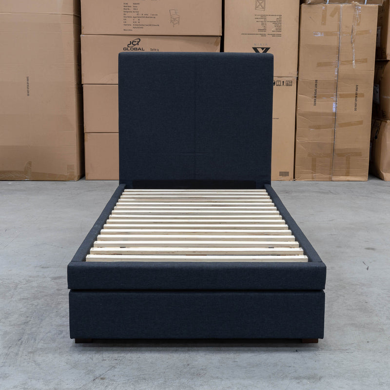 The Cooper Single Fabric Storage Bed - Charcoal available to purchase from Warehouse Furniture Clearance at our next sale event.