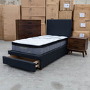 The Cooper Single Fabric Storage Bed - Charcoal available to purchase from Warehouse Furniture Clearance at our next sale event.