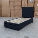 The Cooper Single Fabric Storage Bed - Charcoal available to purchase from Warehouse Furniture Clearance at our next sale event.