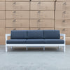 The Artemis Outdoor Three Seat Sofa - White/Dark Grey available to purchase from Warehouse Furniture Clearance at our next sale event.