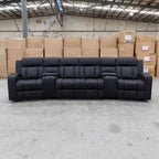The Remi Four Seat Dual-Motor Electric Recliner Lounge - Jet - Floor Stock available to purchase from Warehouse Furniture Clearance at our next sale event.