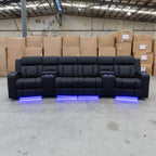 The Remi Four Seat Dual-Motor Electric Recliner Lounge - Jet - Floor Stock available to purchase from Warehouse Furniture Clearance at our next sale event.