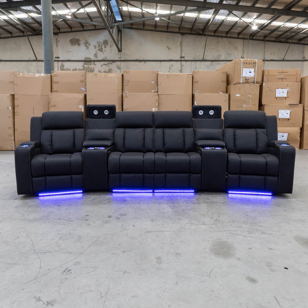 The Remi Four Seat Dual-Motor Electric Recliner Lounge - Jet - Floor Stock available to purchase from Warehouse Furniture Clearance at our next sale event.