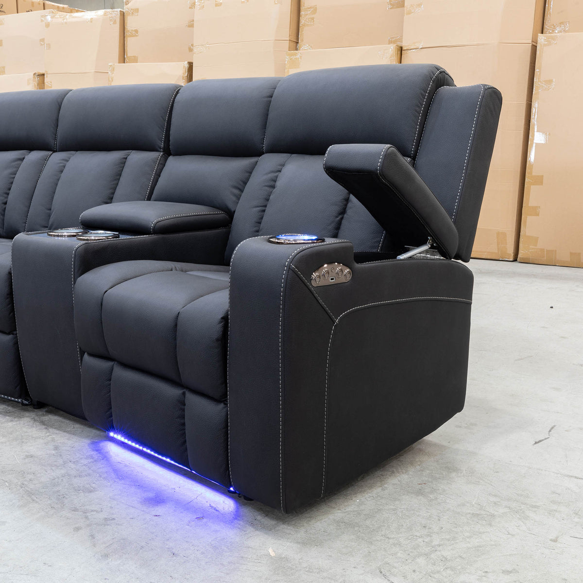 The Remi Four Seat Dual-Motor Electric Recliner Lounge - Jet - Floor Stock available to purchase from Warehouse Furniture Clearance at our next sale event.