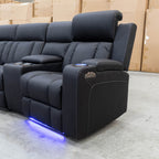 The Remi Four Seat Dual-Motor Electric Recliner Lounge - Jet - Floor Stock available to purchase from Warehouse Furniture Clearance at our next sale event.