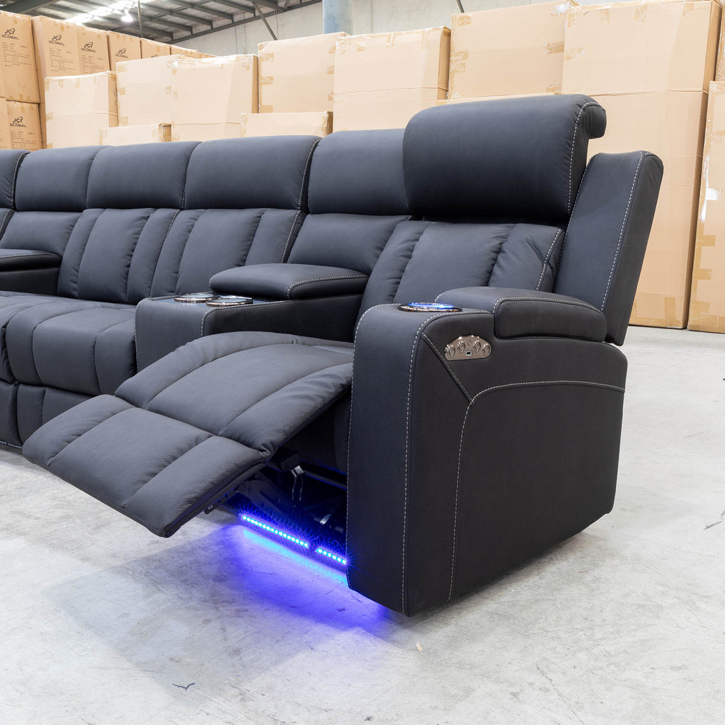 The Remi Four Seat Dual-Motor Electric Recliner Lounge - Jet - Floor Stock available to purchase from Warehouse Furniture Clearance at our next sale event.