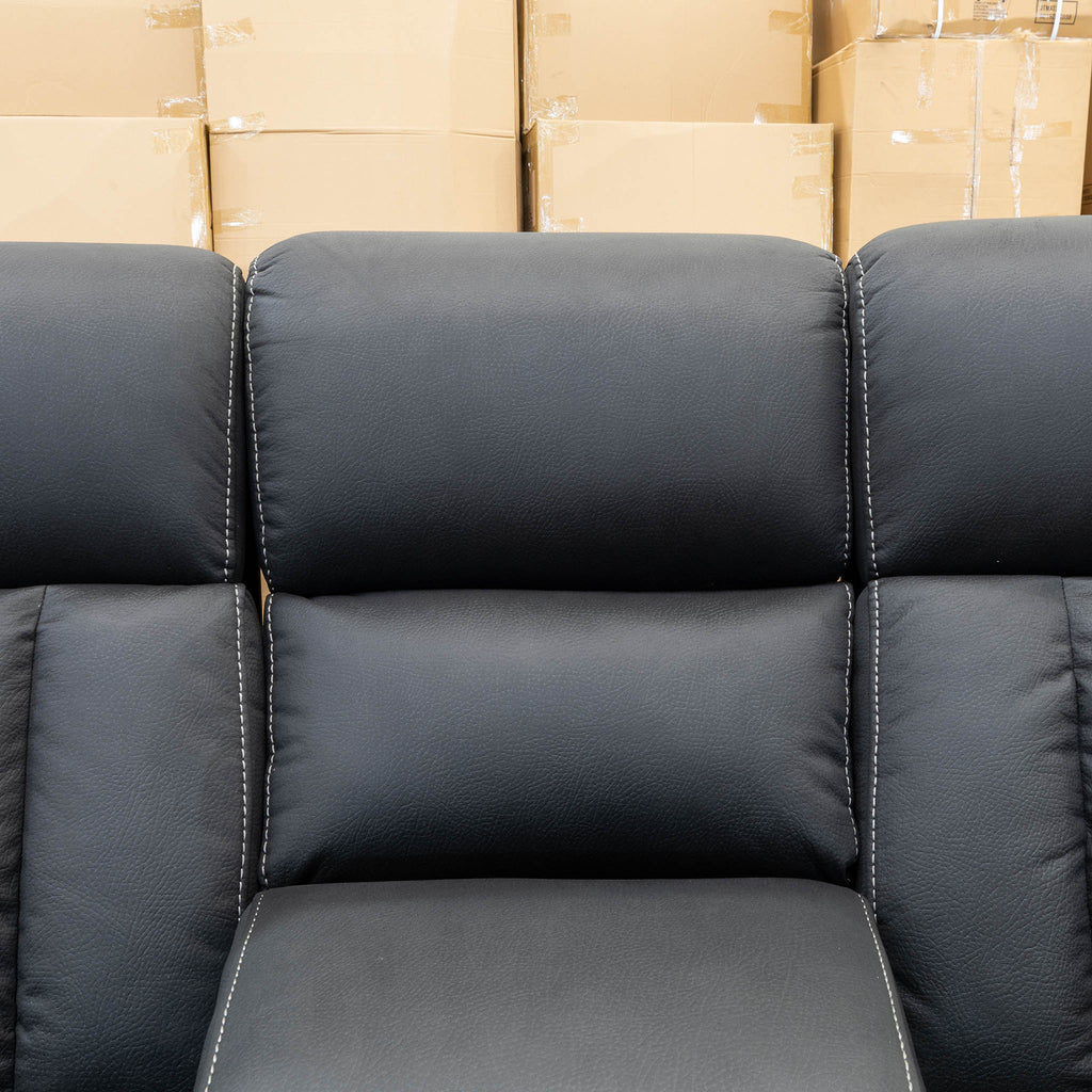 The Remi Four Seat Dual-Motor Electric Recliner Lounge - Jet - Floor Stock available to purchase from Warehouse Furniture Clearance at our next sale event.