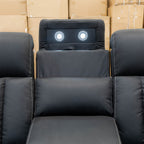 The Remi Four Seat Dual-Motor Electric Recliner Lounge - Jet - Floor Stock available to purchase from Warehouse Furniture Clearance at our next sale event.