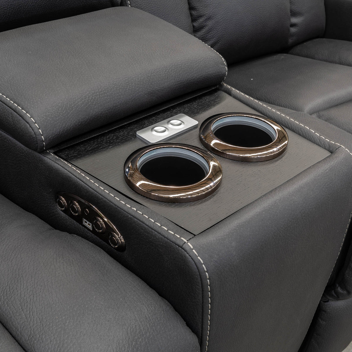 The Remi Four Seat Dual-Motor Electric Recliner Lounge - Jet - Floor Stock available to purchase from Warehouse Furniture Clearance at our next sale event.