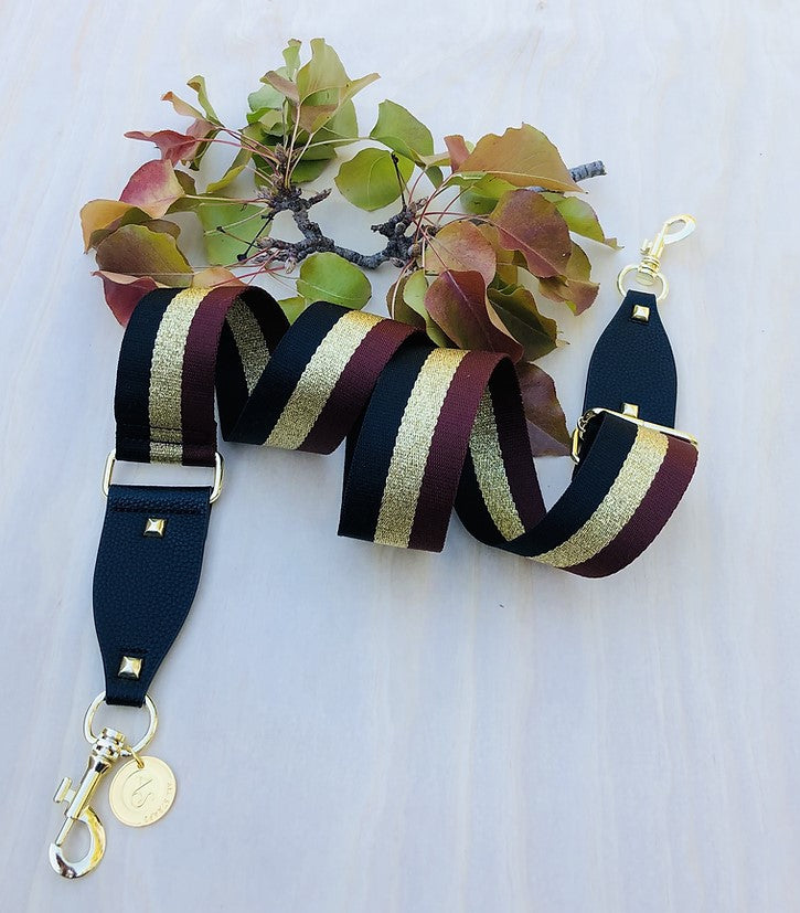The Black, Gold & Brown Strip - Bag Strap - Gold Hardware available to purchase from Warehouse Furniture Clearance at our next sale event.