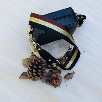 The Black, Gold & Brown Strip - Bag Strap - Gold Hardware available to purchase from Warehouse Furniture Clearance at our next sale event.