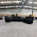 The Remi Dual-Electric Recliner - Jet available to purchase from Warehouse Furniture Clearance at our next sale event.